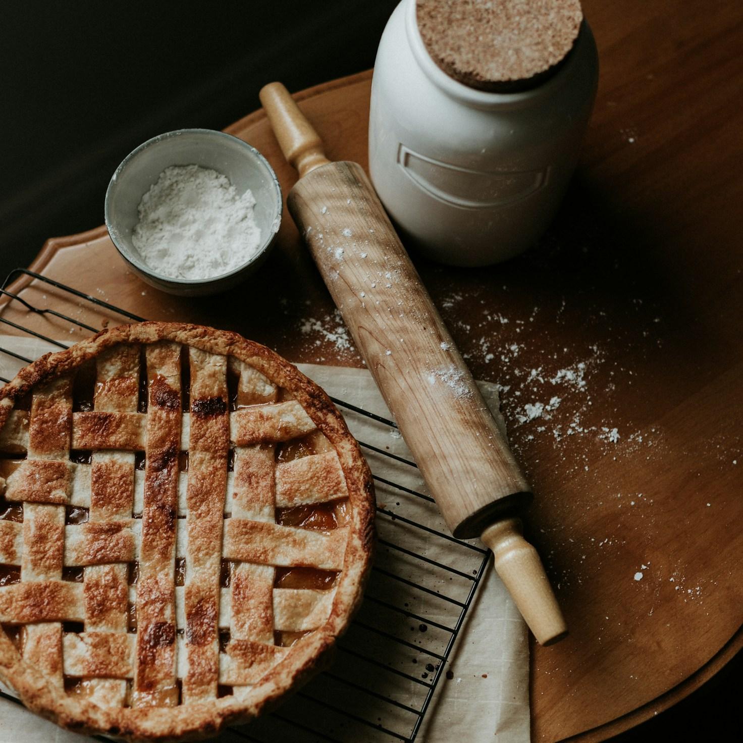 Community members collaborating in a contemporary kitchen, sharing recipes and techniques